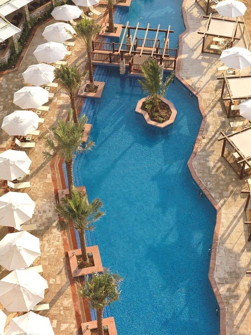 Expansive Pool with Private Cabanas